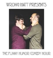 Two men stand facing each other, each holding the other’s face with both hands. One wears glasses and a red shirt, the other has a shaved head and gray shirt. Text above and below reads “WRONG MATT PRESENTS THE FUNNY HUMOR COMEDY HOUR.”.