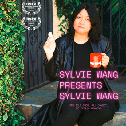 A person with long dark hair in a black coat sits on outdoor steps, holding a red mug and a cigarette. Text reads SYLVIE WANG PRESENTS SYLVIE WANG and two award symbols appear in the top left corner.