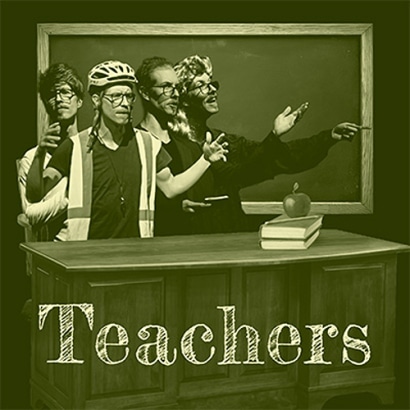 Four people dressed as teachers stand in front of a chalkboard and desk with books and an apple. The word “Teachers” is displayed prominently at the bottom of the image.