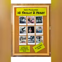 A corkboard displays twelve Polaroid photos, a yellow note reading David Piccolomini 10 Skills 2 Years, and smaller notes saying A comedy show about learning, addiction, and video games and At the Denver Fringe.