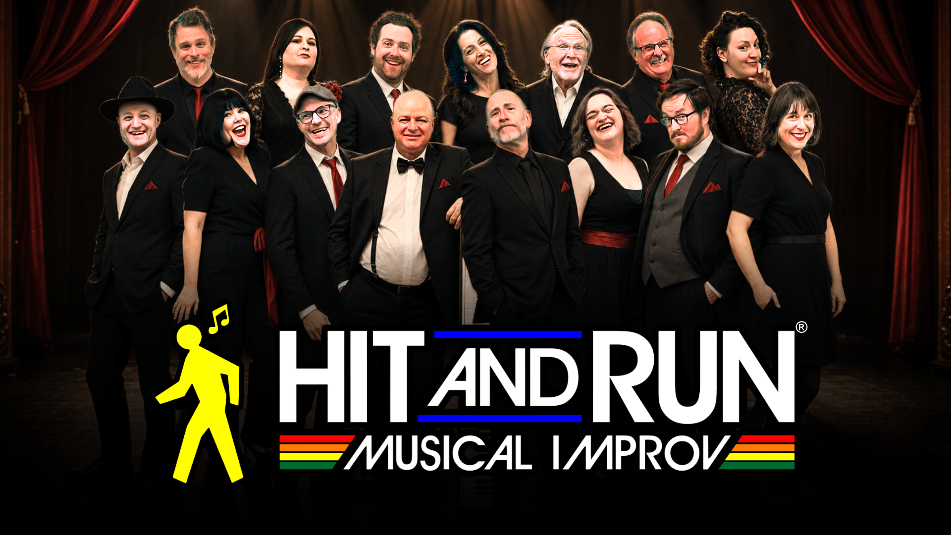A diverse group of people in formal black and red outfits pose on stage with Hit and Run Musical Improv logo in front of them, featuring a yellow walking figure and musical notes.
